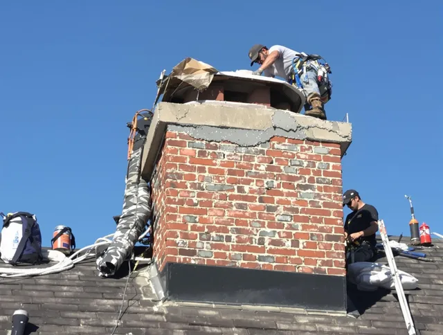 Tamarac Chimney Sweep installing a custom chimney crown in Tamarac, FL