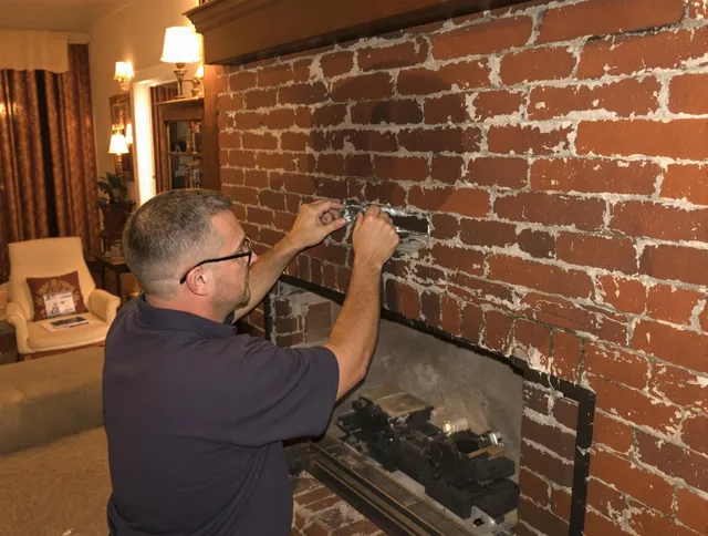 Tamarac Chimney Sweep expert fixing a fireplace in Tamarac, FL